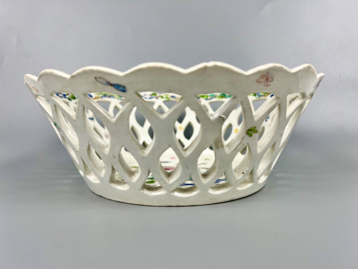 A pair of large Bow porcelain famille rose reticulated baskets c.1752