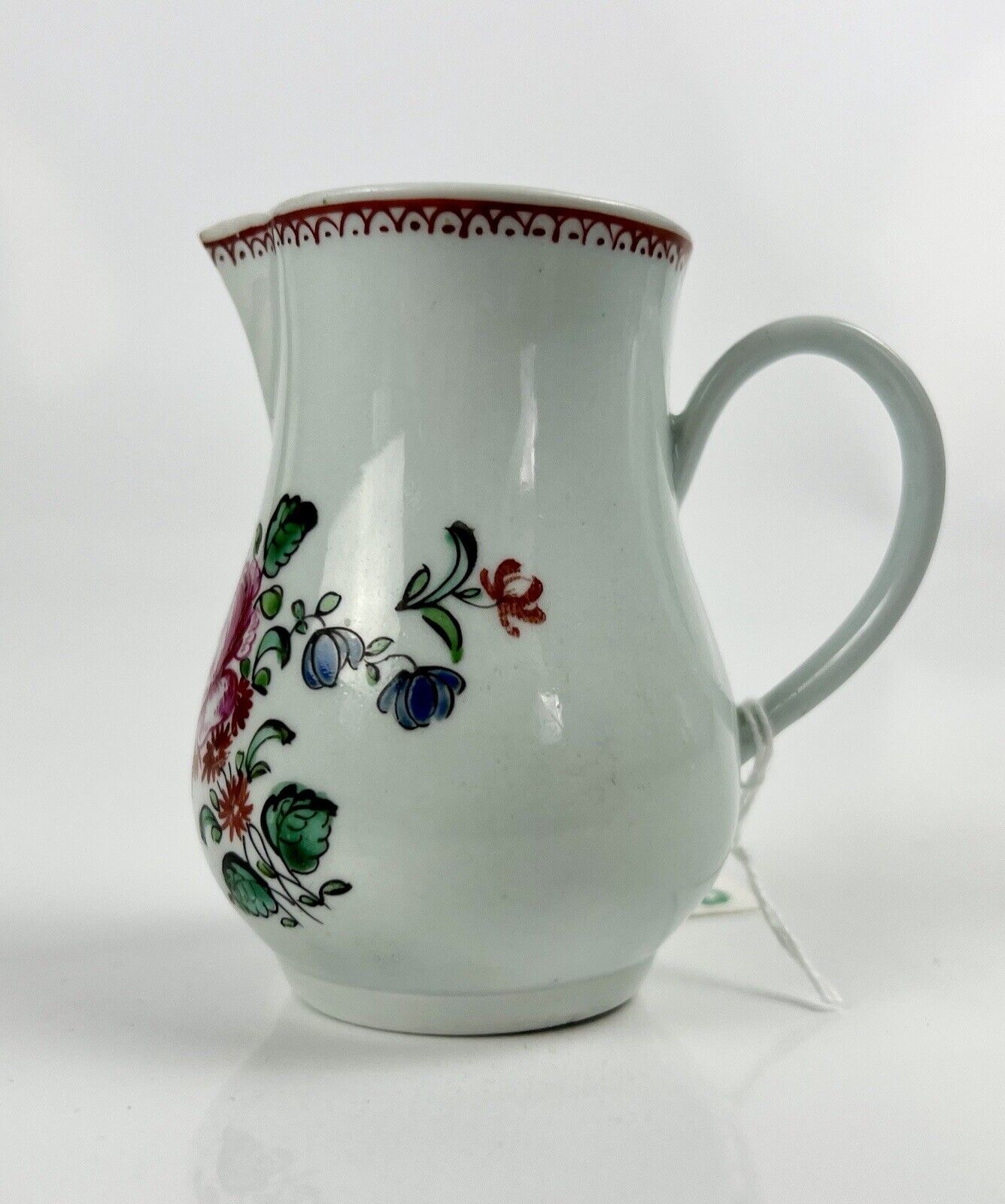 A Philip Christian Liverpool floral-decorated sparrowbeak jug. c.1770