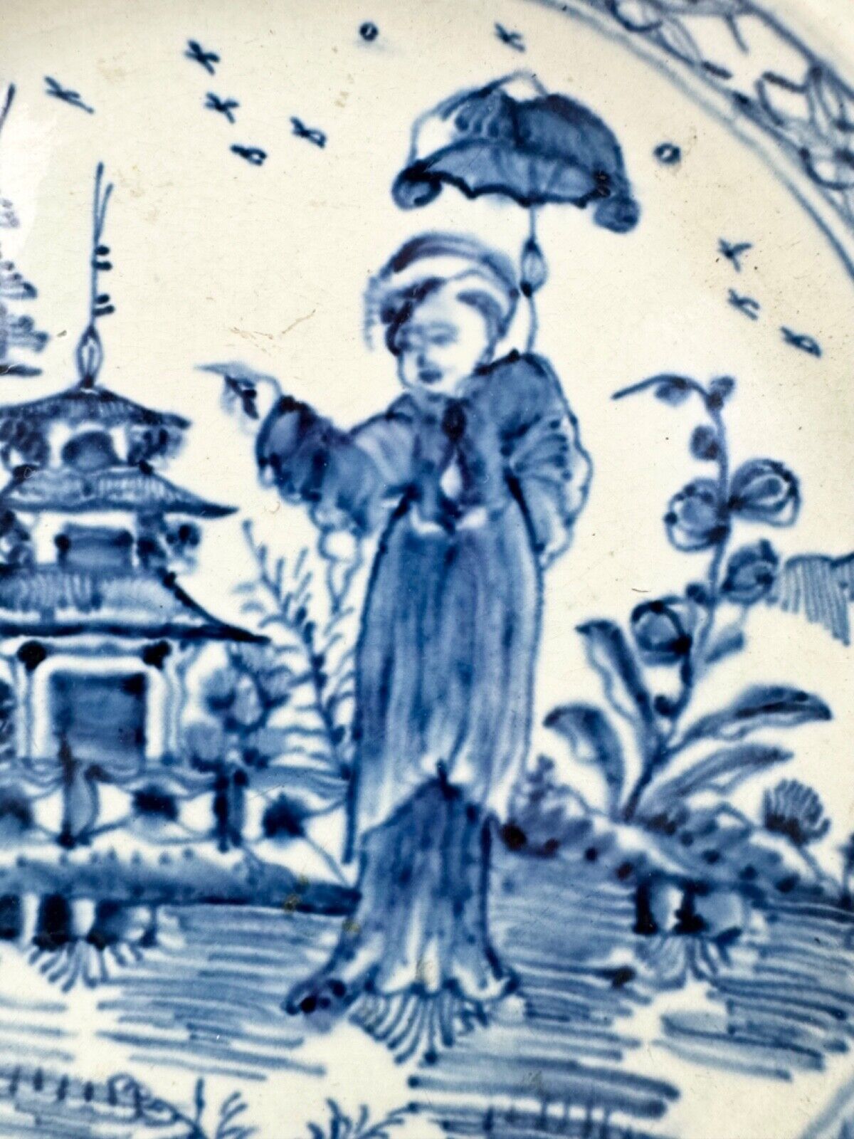 A fine pearlware reticulated plate painted with a 'Long Eliza' figure. c.1790