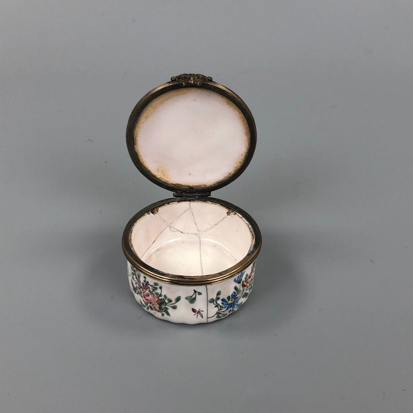 An early 19thc. Continental enamel box. Hand Painted with a boy piper.