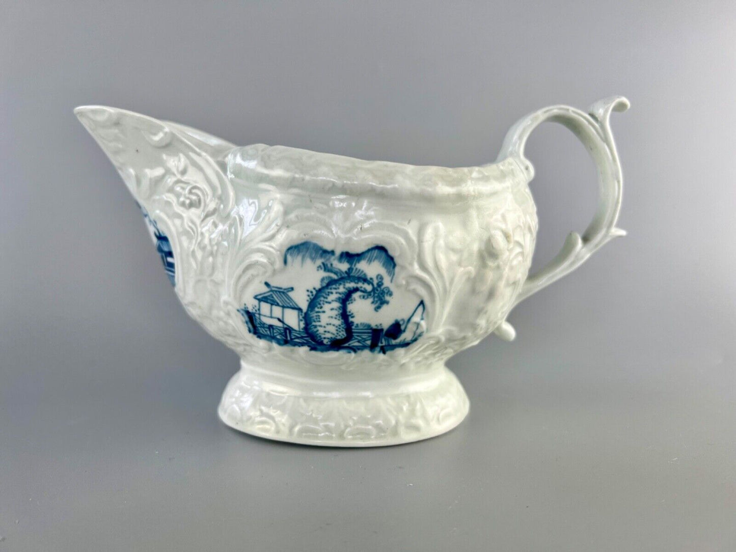 A Worcester porcelain 'Two Porters Landcsape v.1' pattern sauceboat c1770