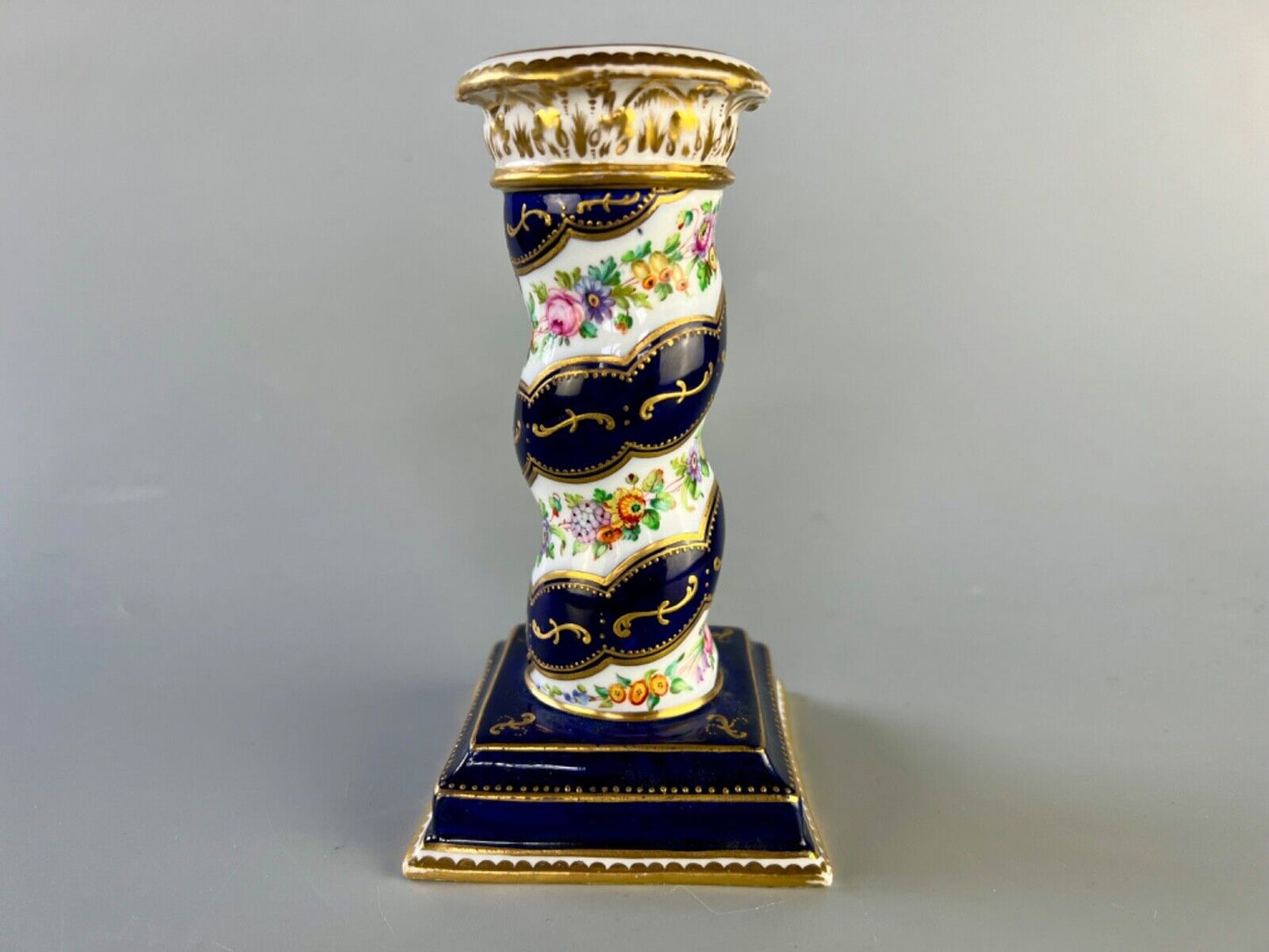 A pair of c 1810-25 Coalport Coalbrookdale spiral-moulded candlesticks.