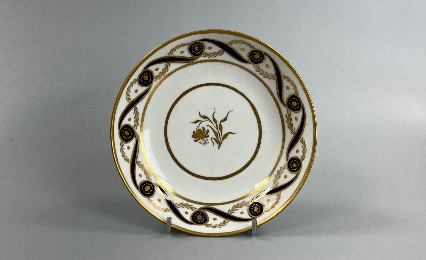 A c.1787-95 New Hall clip handle cup and saucer in pattern number 170