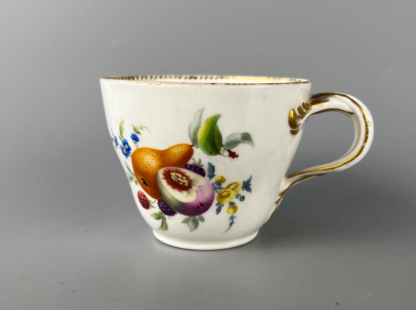 A set of four Meissen Marcolini Period c.1800 bifurcated-handle coffee cups.