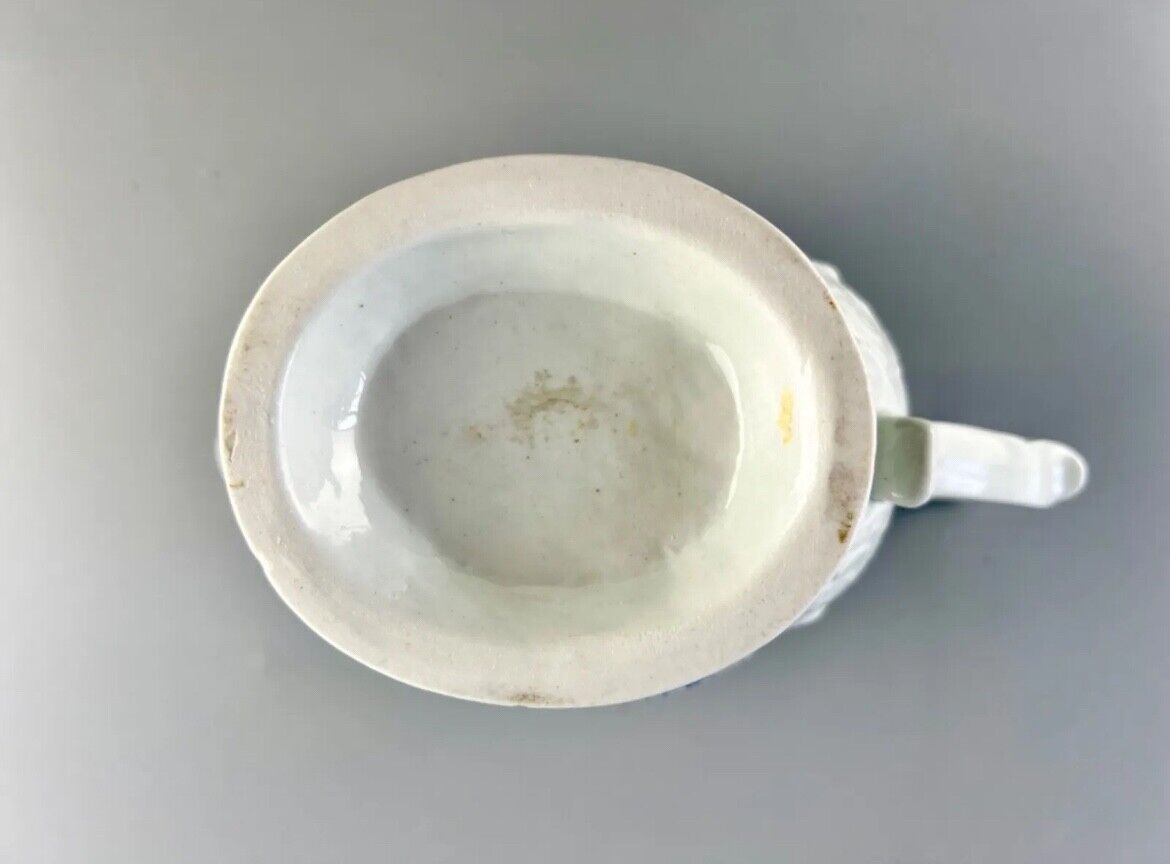 Christian Liverpool porcelain moulded sauceboat with oriental decoration. c.1770