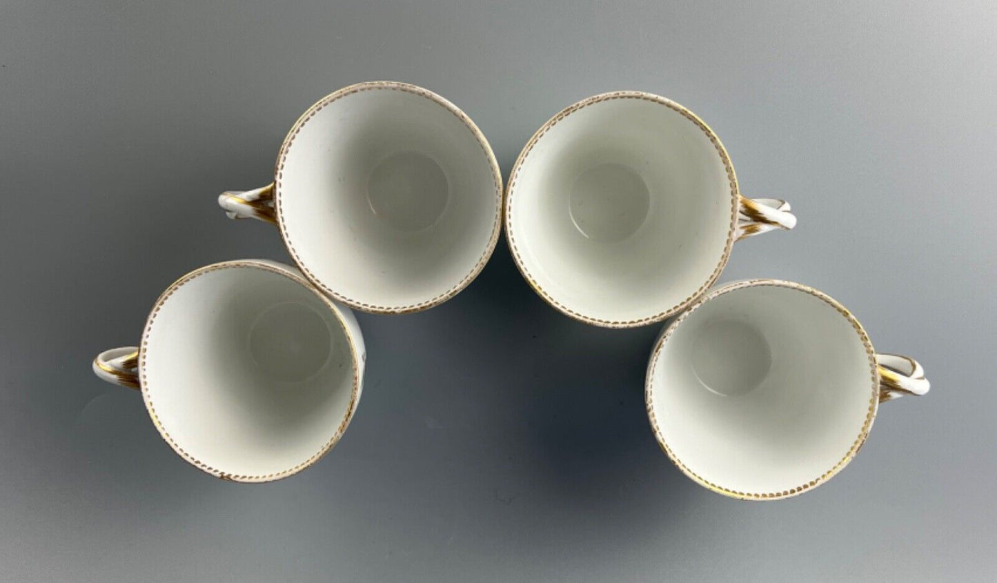 A set of four Meissen Marcolini Period c.1800 bifurcated-handle coffee cups.