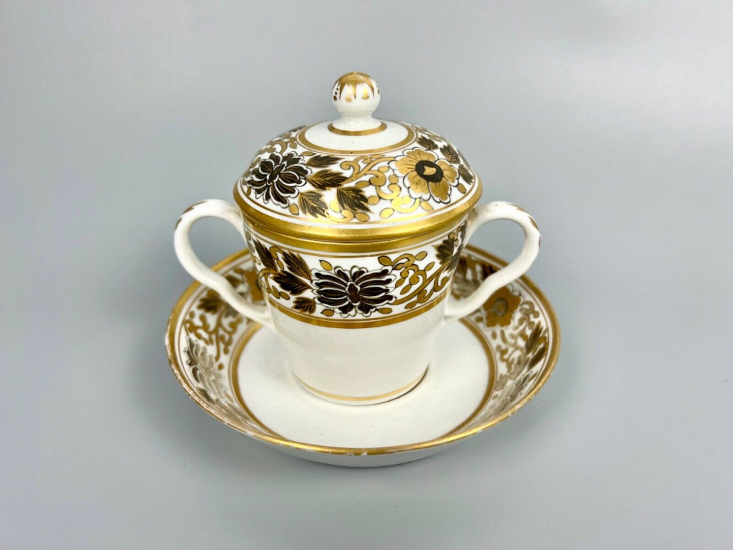 A pair of Chamberlain Worcester chocolate cups, covers and stands c1795