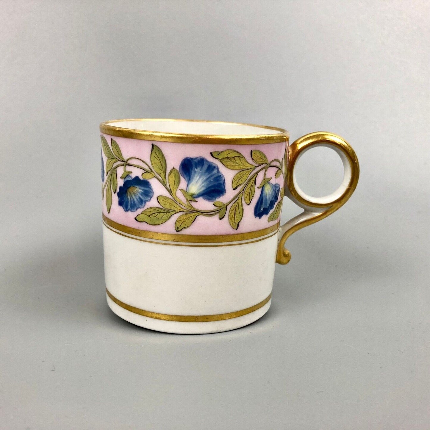 A Barr Worcester coffee can with a floral band on salmon ground c.1795-1805
