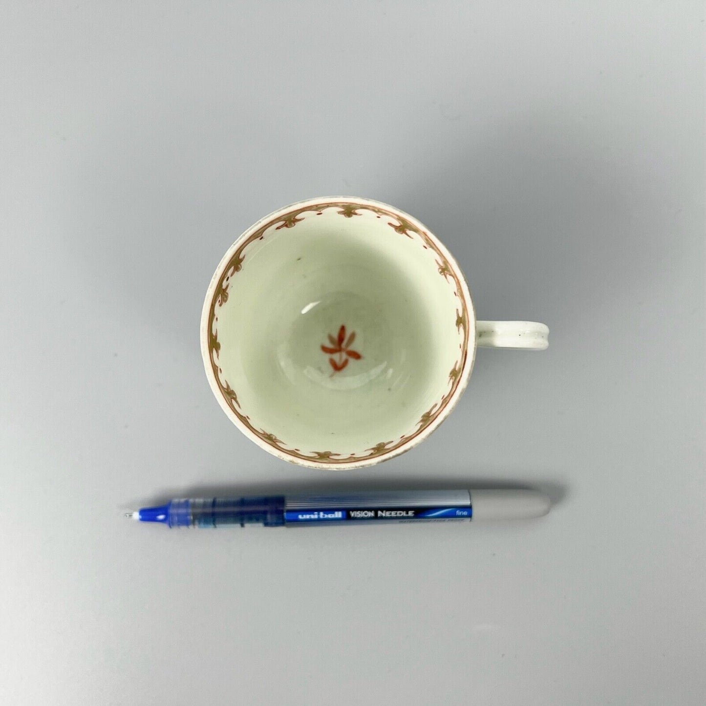 1st Period Worcester outside decorated coffee cup. Gilt trellis inner rim. c1770