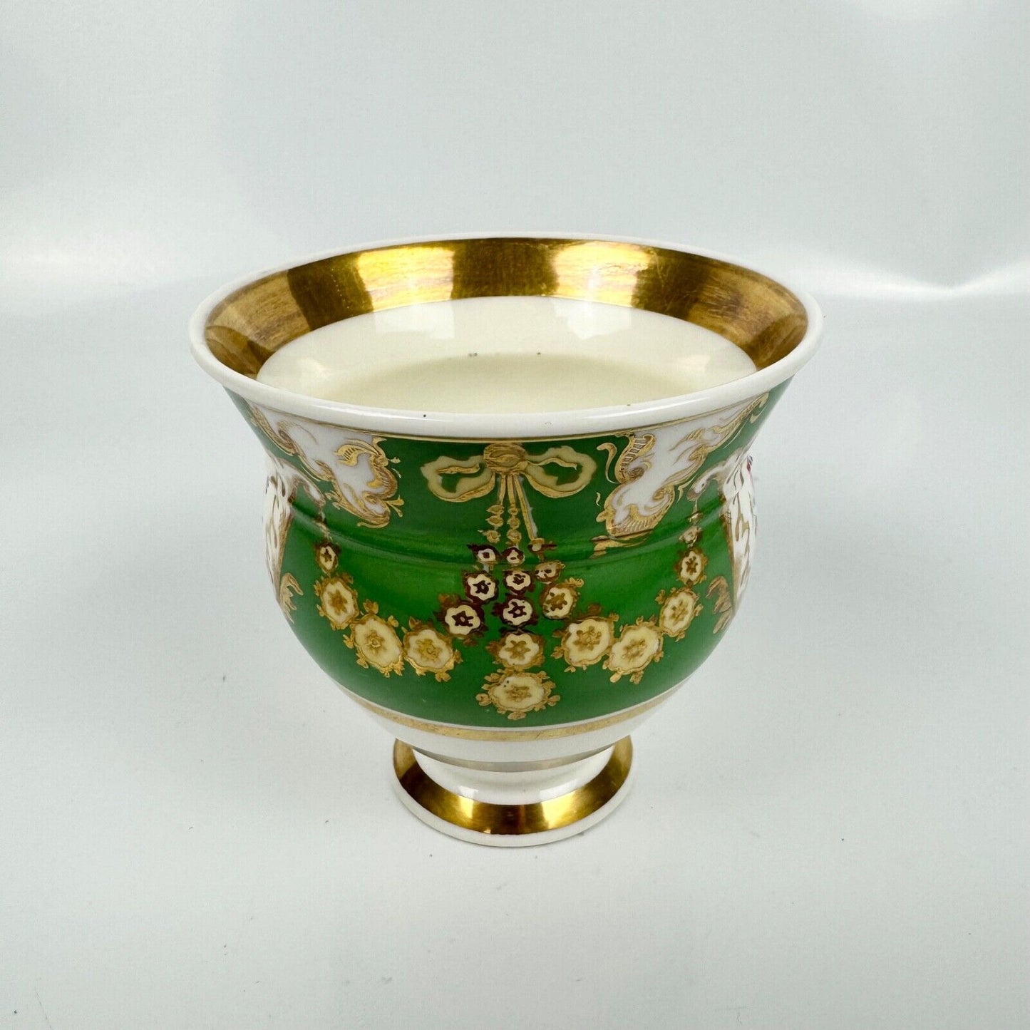 Rockingham horsetail & hoof handled coffee cup& saucer. Red griffin mark. c1826.