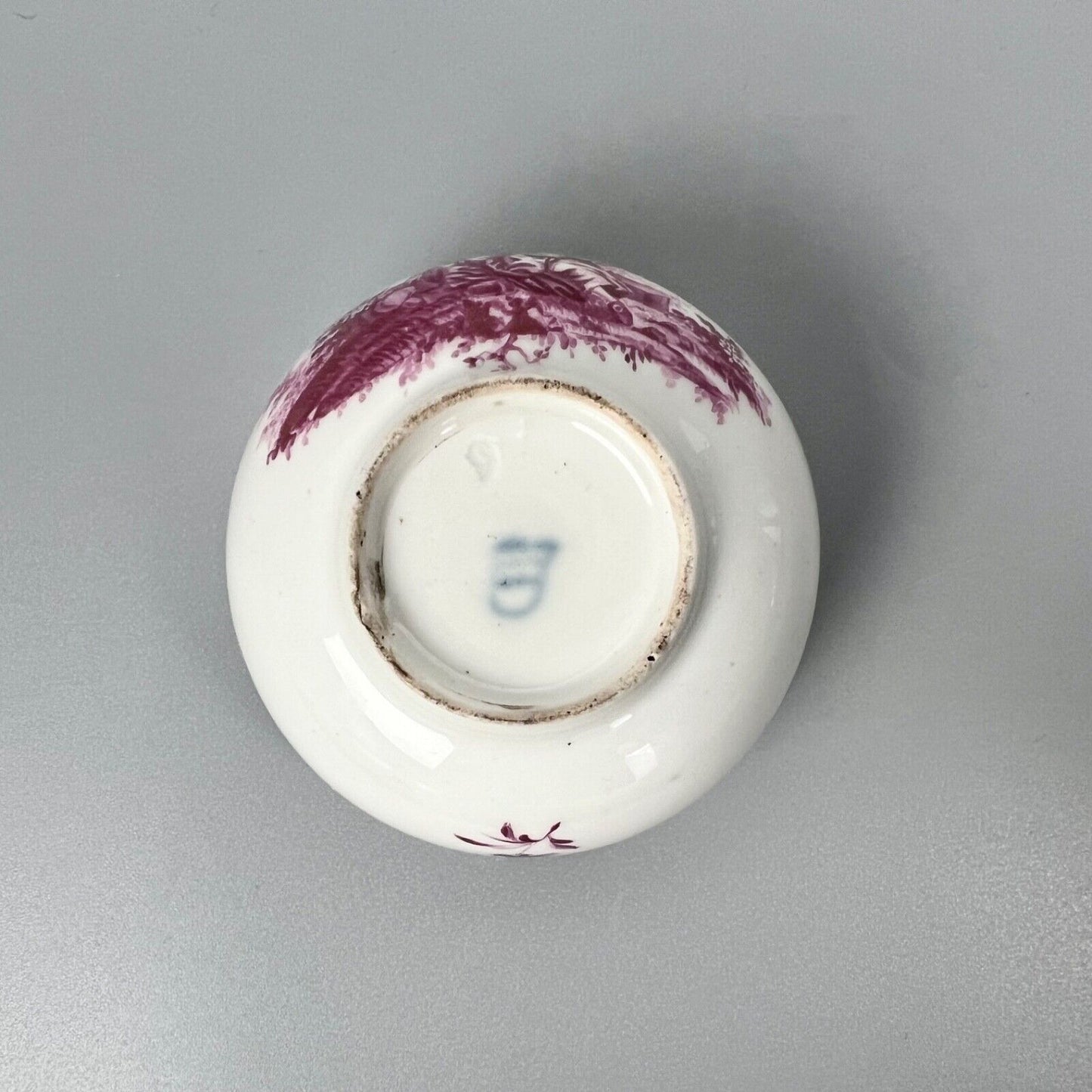 A Vienna porcelain teabowl painted with puce figures c1770-5