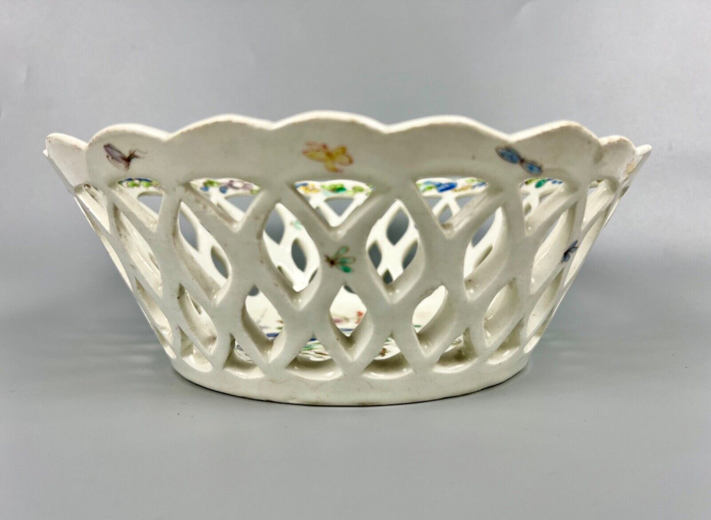 A pair of large Bow porcelain famille rose reticulated baskets c.1752