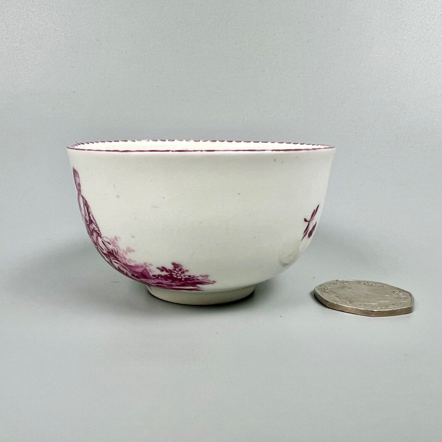 A Vienna porcelain teabowl painted with puce figures c1770-5