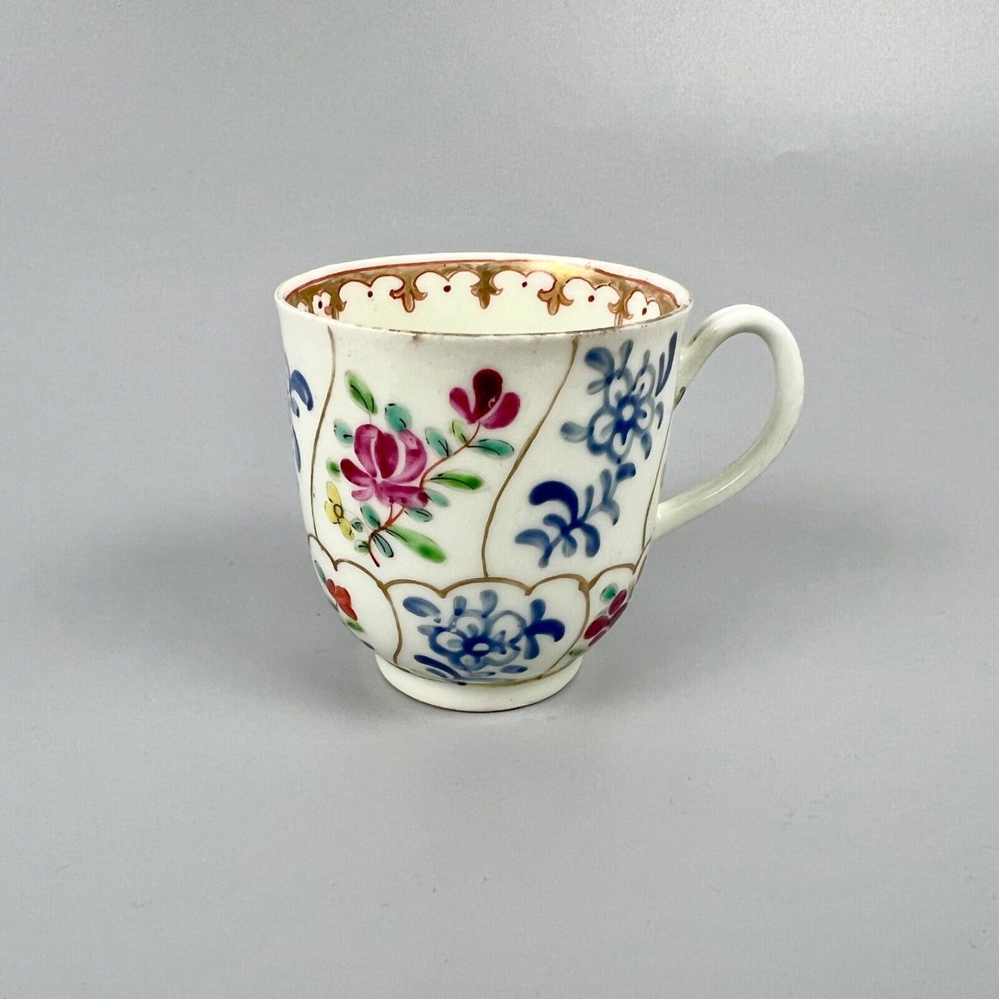 1st Period Worcester outside decorated coffee cup. Gilt trellis inner rim. c1770