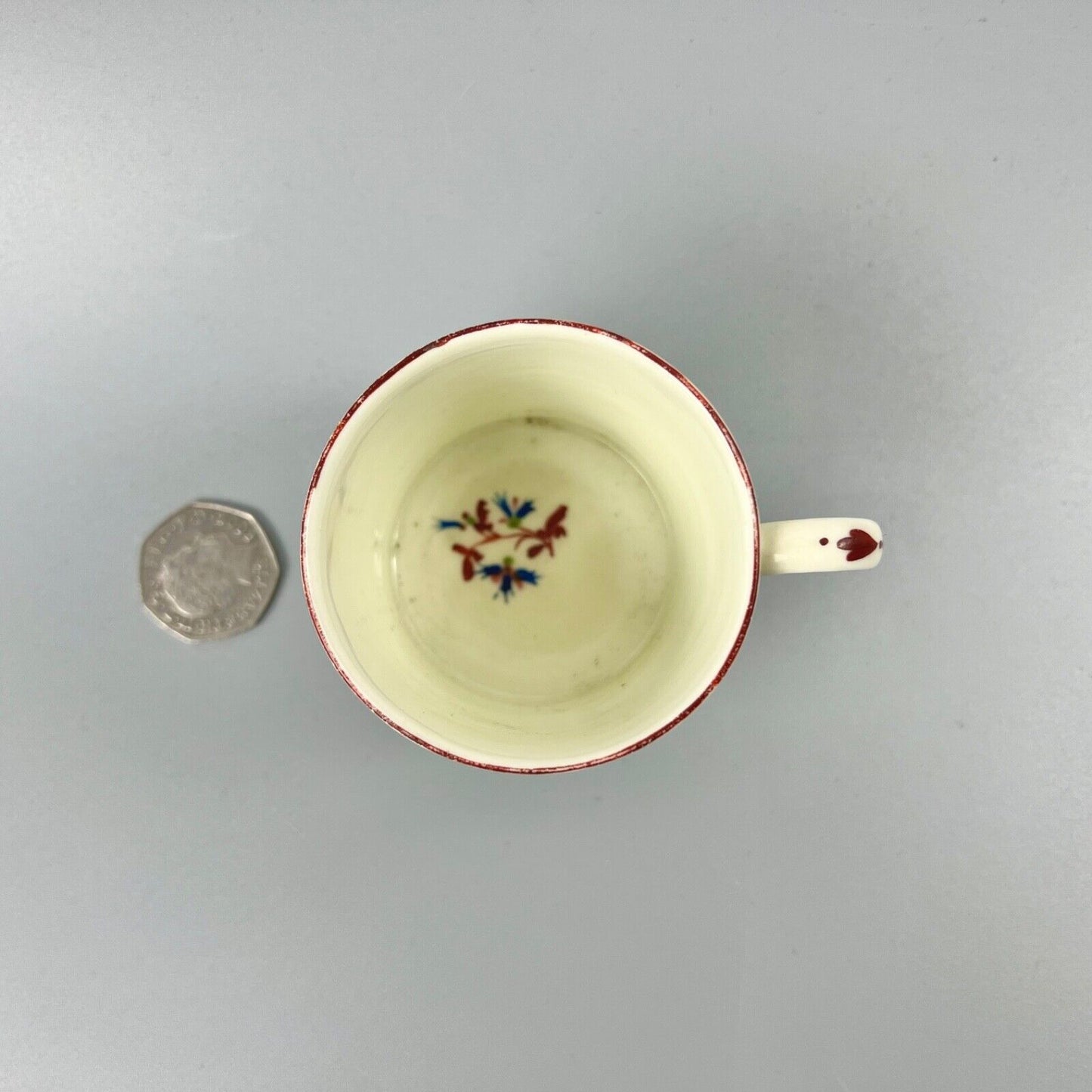 A Pinxton pattern one coffee can painted with Barbeaux Sprigs c1800