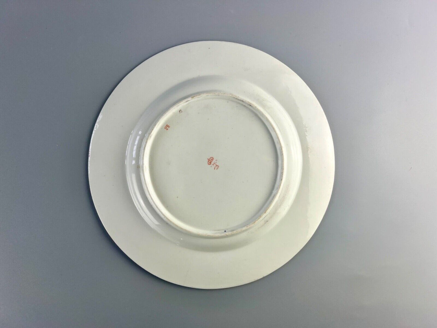 An early 19thc Derby floral-painted (probably by Leonard Lead) plate.