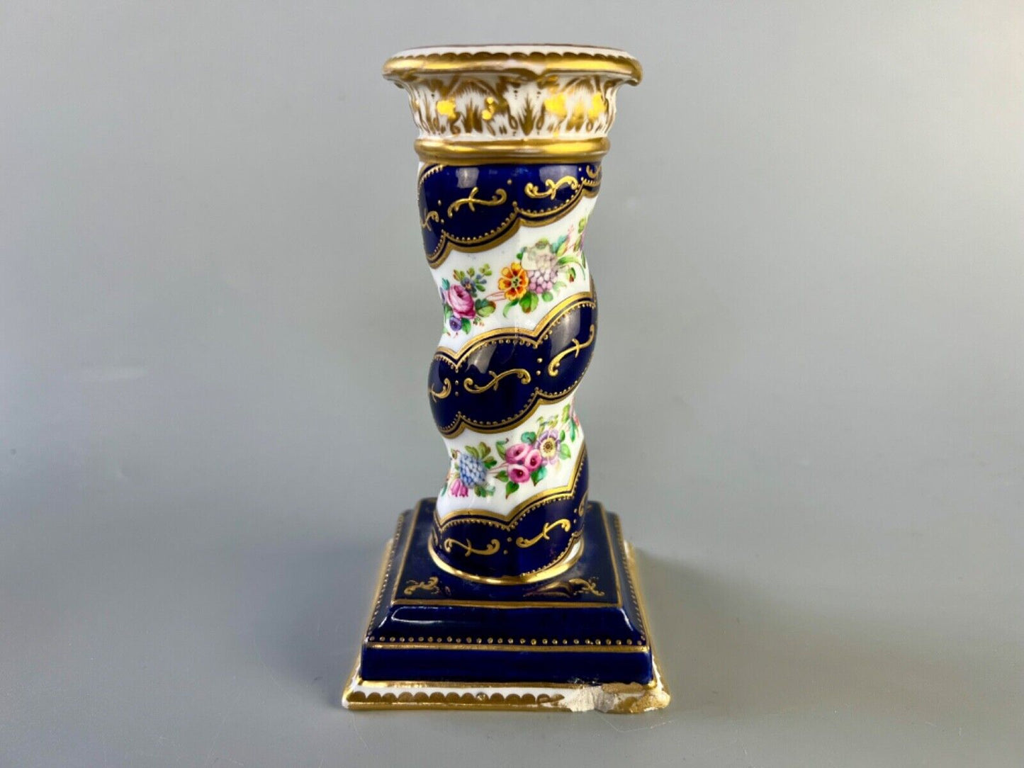 A pair of c 1810-25 Coalport Coalbrookdale spiral-moulded candlesticks.
