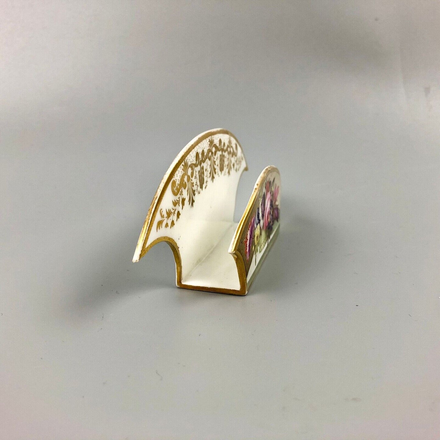 An uncommon Derby letter rack painted with flowers by Leonard Lead c.1820