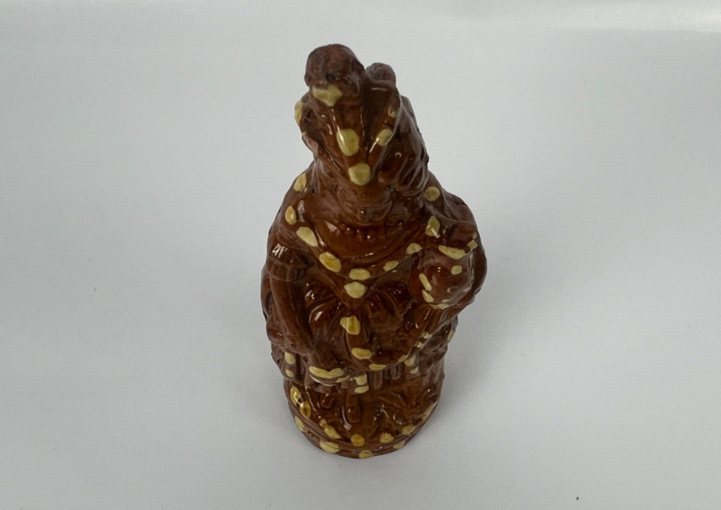 A cream dot decorated slipware figure of a woman on a treacle ground c1835