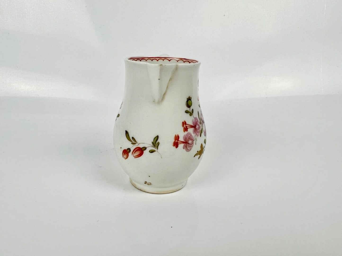 A Lowestoft 'Tulip Painter' creamer painted with floral sprays c.1775