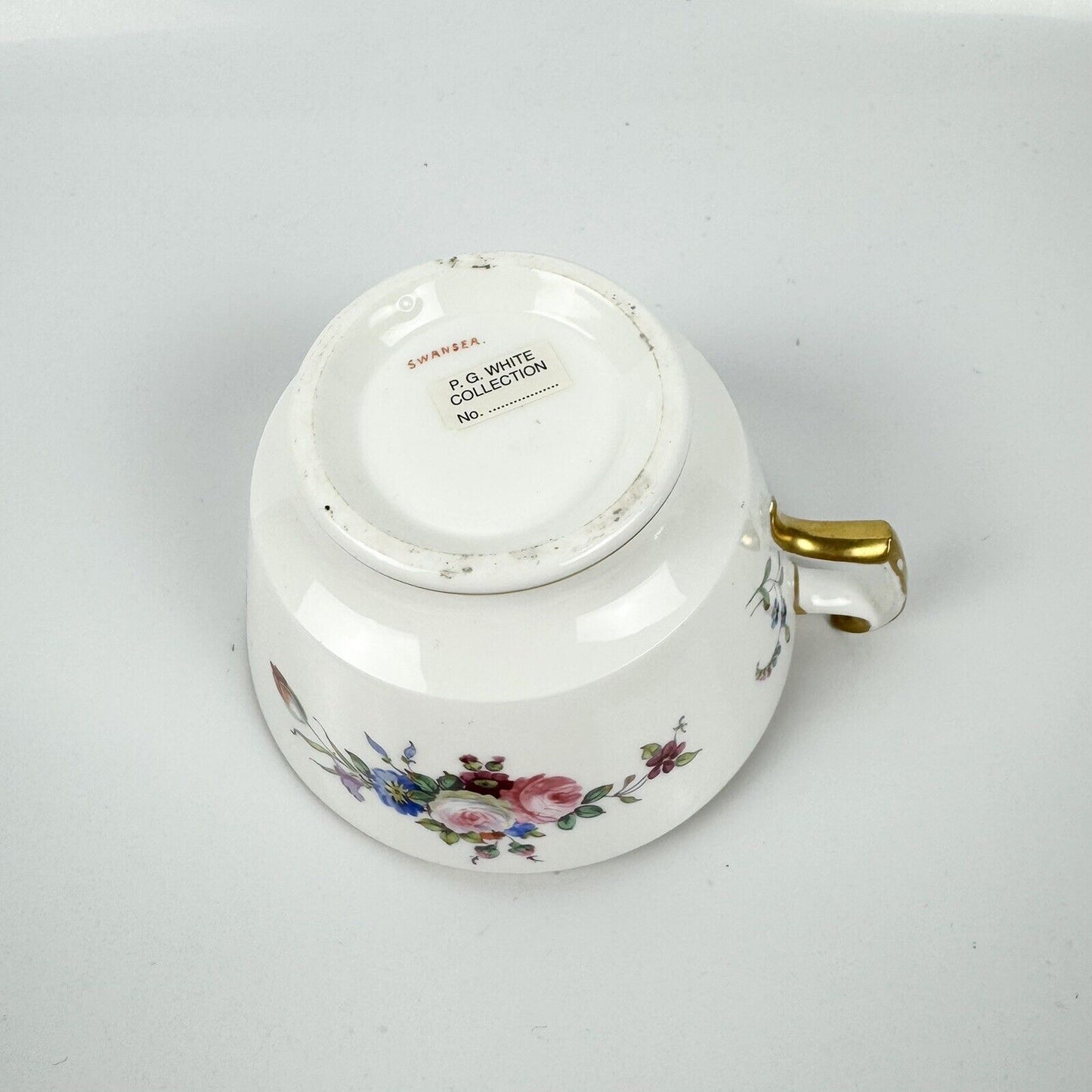 A good Swansea breakfast cup and saucer with floral decoration c1814-7