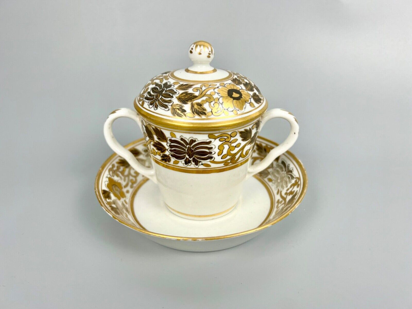 A pair of Chamberlain Worcester chocolate cups, covers and stands c1795