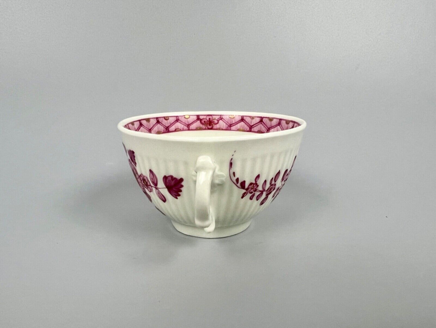 A rare Worcester reeded teacup and saucer painted in Meissen style. c.1772