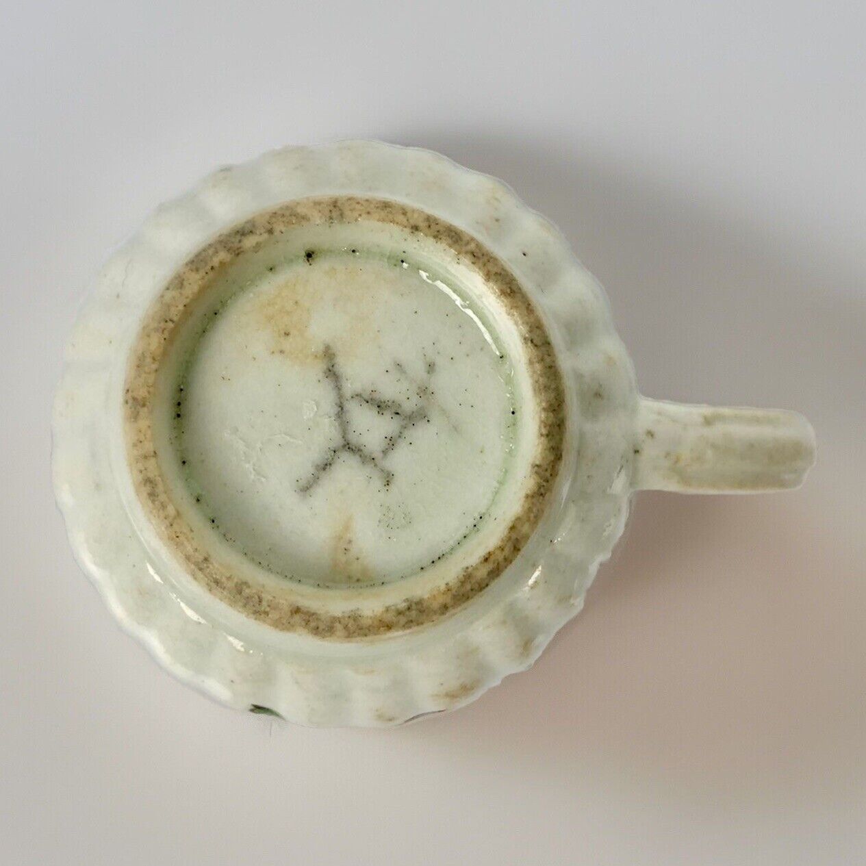 A Seth Pennington fluted coffee cup with blue and gilt border .1780-90