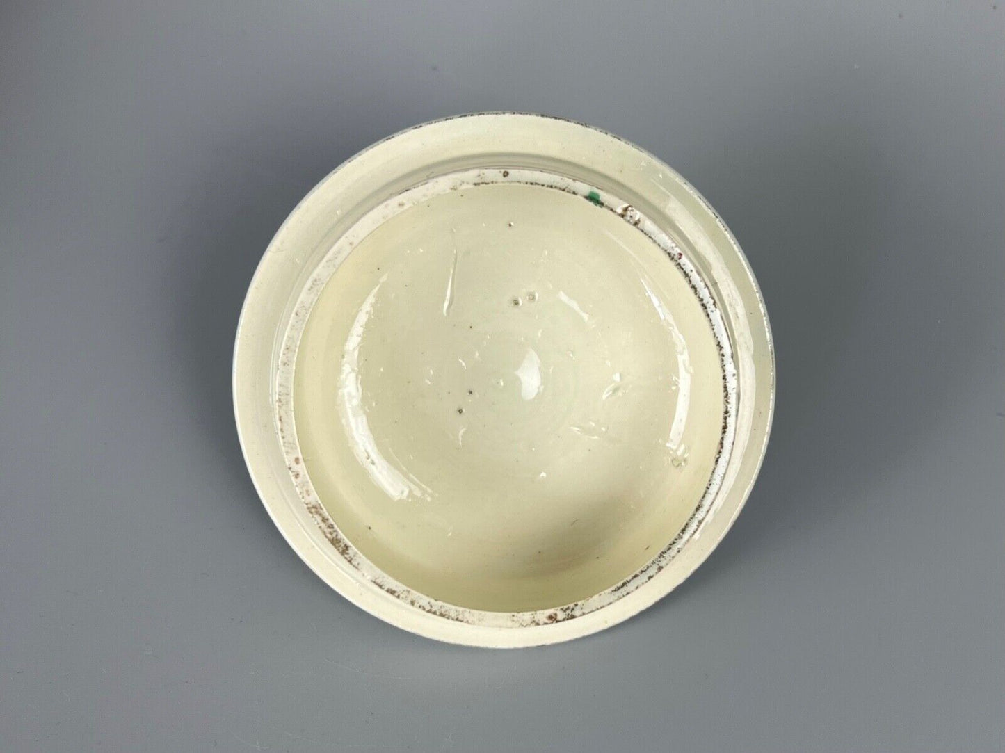 A late 18thc pearlware covered jug. Polychrome floral decoration.