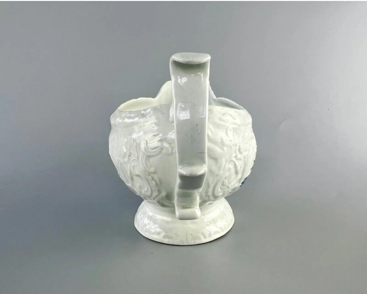 Christian Liverpool porcelain moulded sauceboat with oriental decoration. c.1770