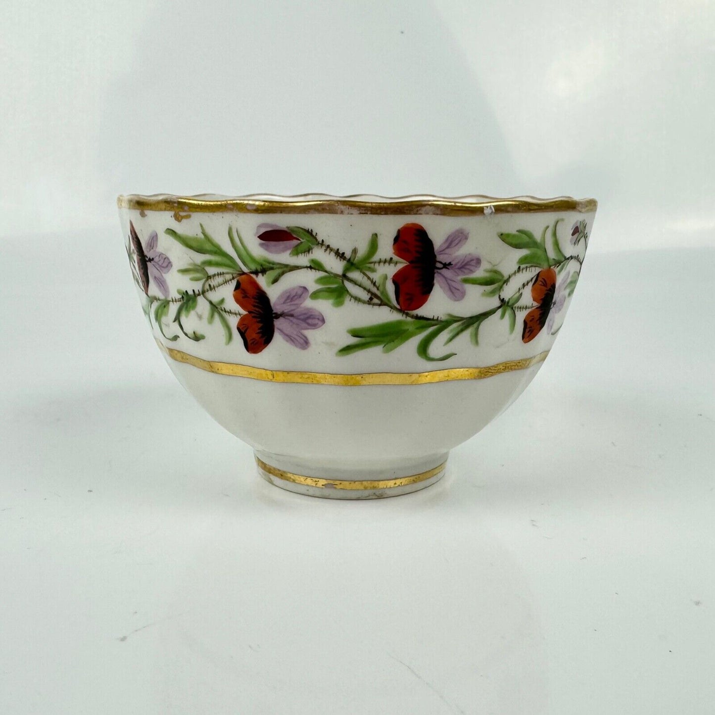 A Pinxton teabowl & saucer in a known pattern of unrecorded number circa 1805