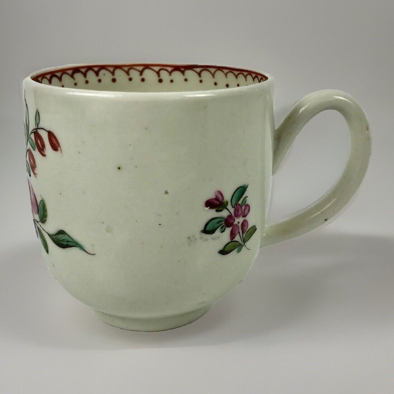 A c.1765-75 Liverpool Philip Christian polychrome floral painted coffee cup