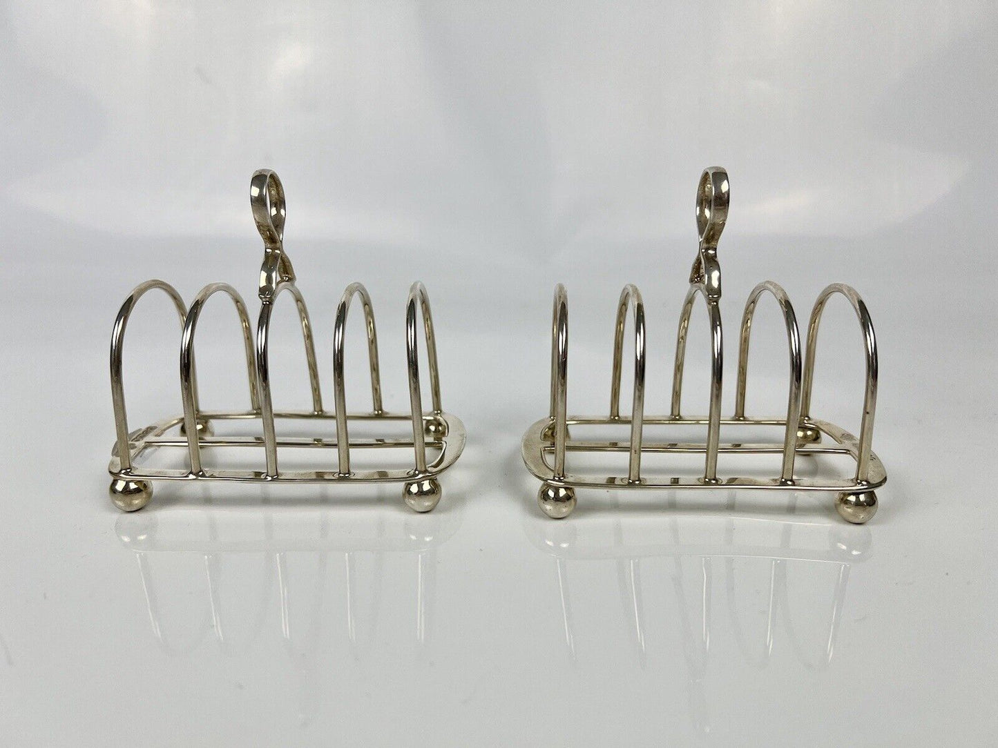 A Pair Of Goldsmith And Silversmith's Company Toastracks. Sheffield 1935.
