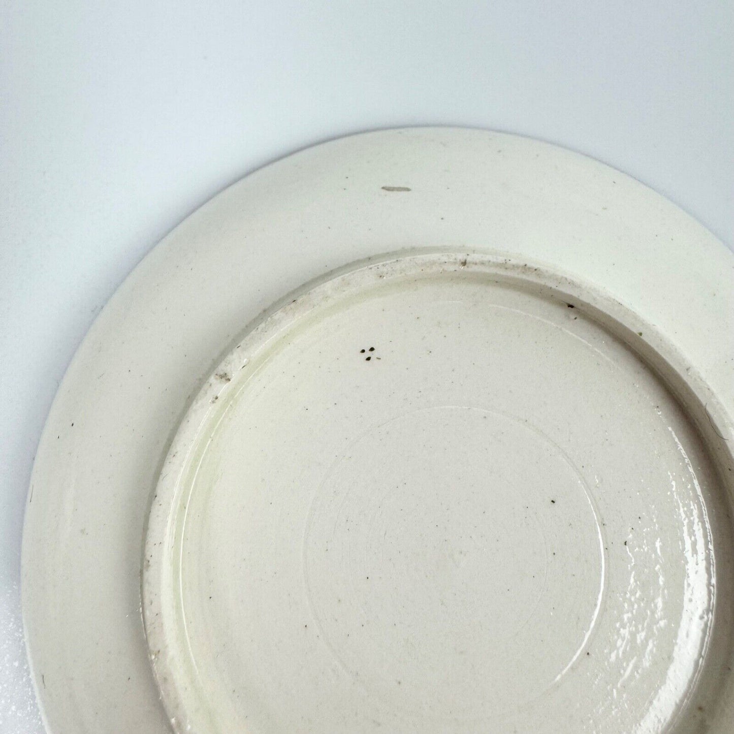 A fine creamware teabowl and saucer with painted foliate decoration. c.1790