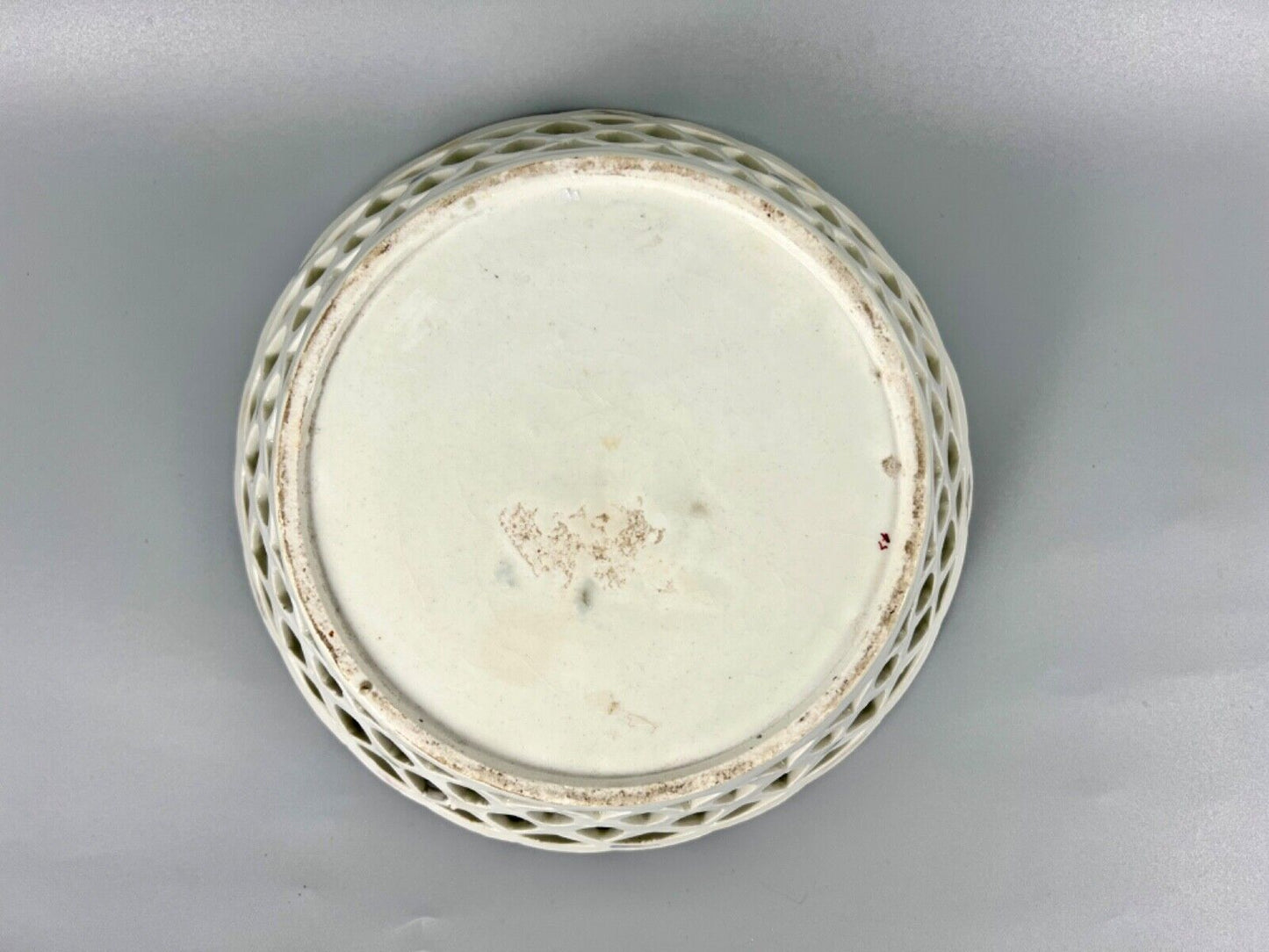 A pair of large Bow porcelain famille rose reticulated baskets c.1752