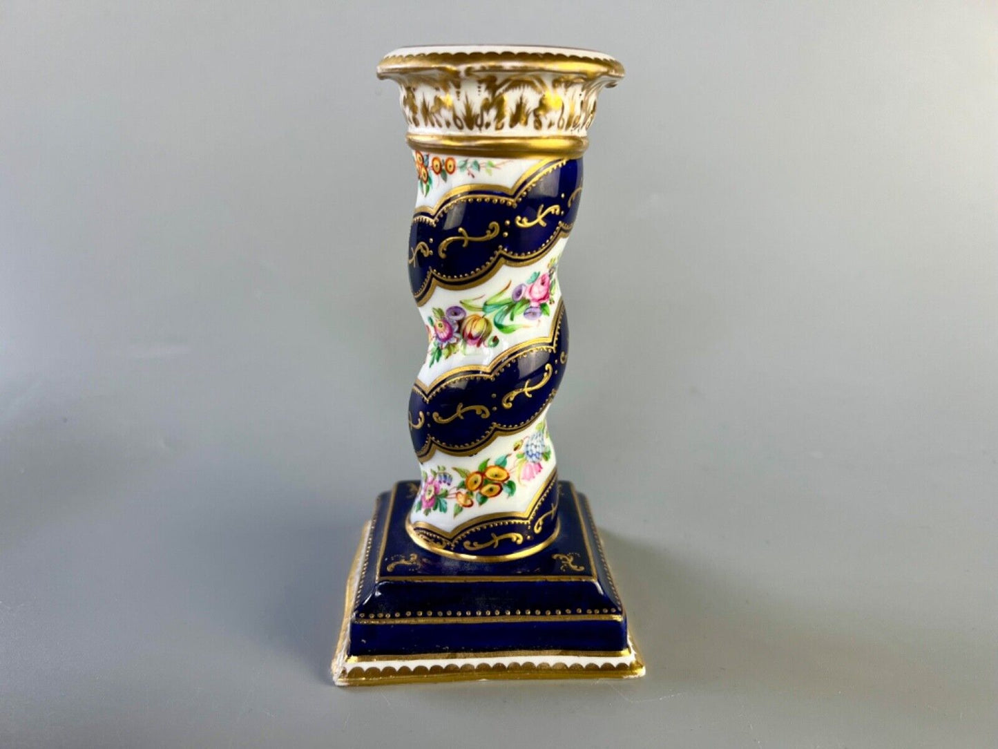 A pair of c 1810-25 Coalport Coalbrookdale spiral-moulded candlesticks.