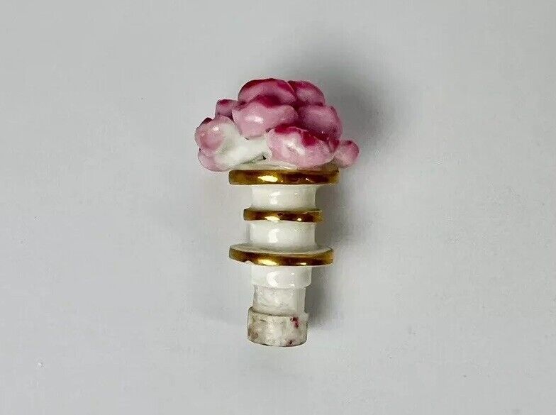 Rockingham porcelain flower encrusted tapered scent bottle. Puce Mark. c.1831-7
