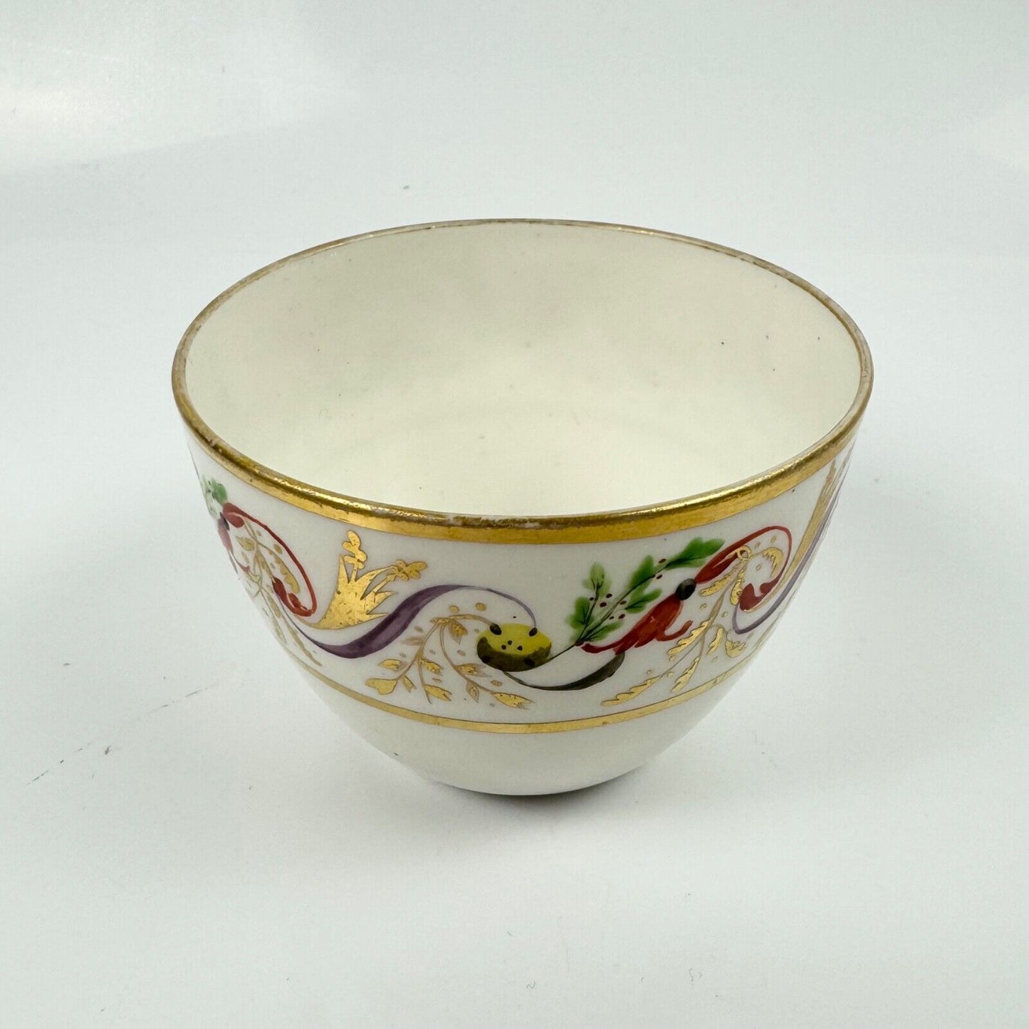 A good Pinxton tea cup and saucer c1796-9 in pattern 301.