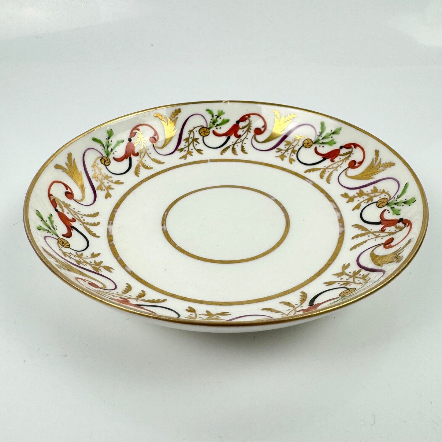 A good Pinxton tea cup and saucer c1796-9 in pattern 301.