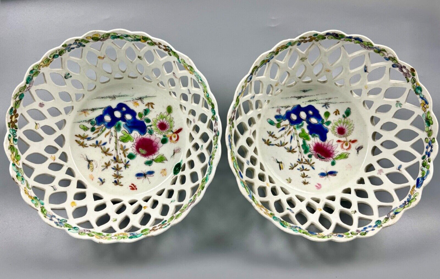 A pair of large Bow porcelain famille rose reticulated baskets c.1752