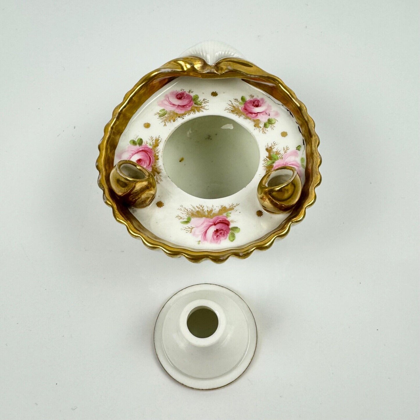 A fine shell-shaped Swansea inkwell and liner painted with roses c1814-26