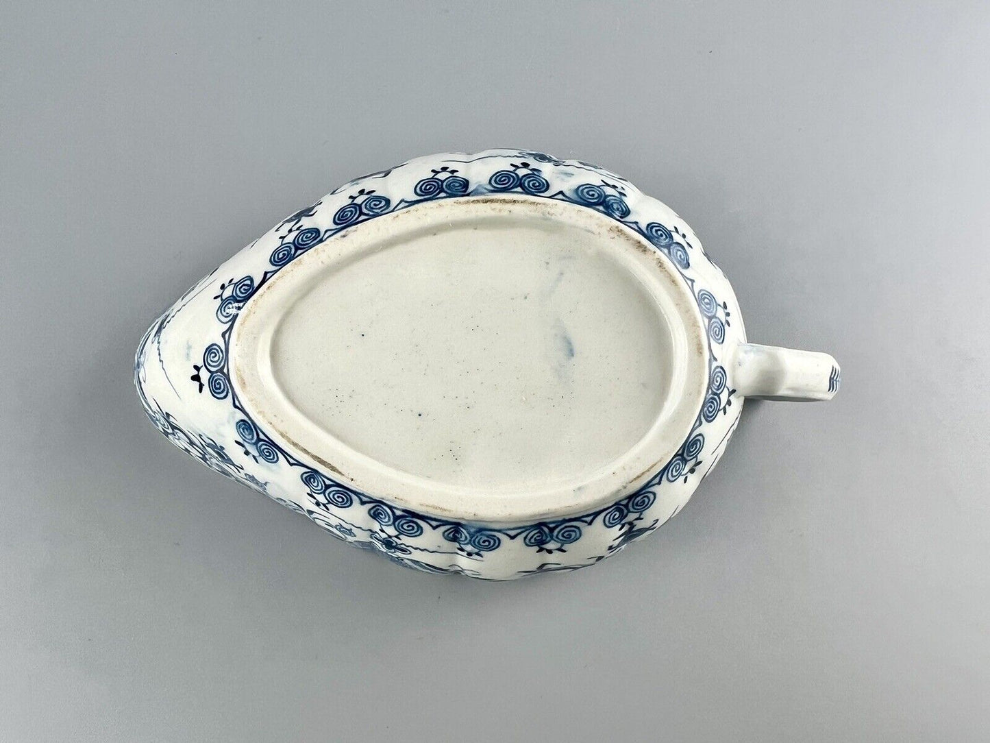 A Worcester First Period "Doughnut Tree" sauceboat. c.1777