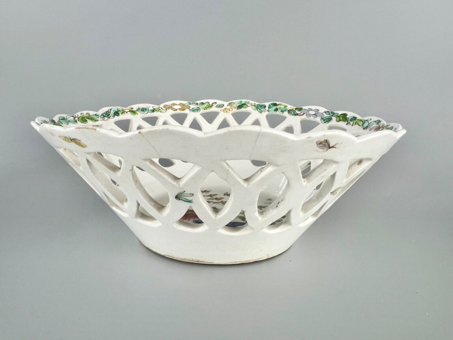 A fine and early Bow porcelain famille rose reticulated basket c.1752