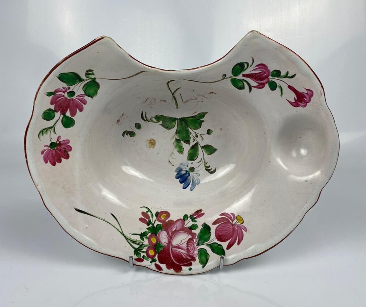 A Strasbourg French Faïence polychrome floral painted barber's bowl. c1790-1820