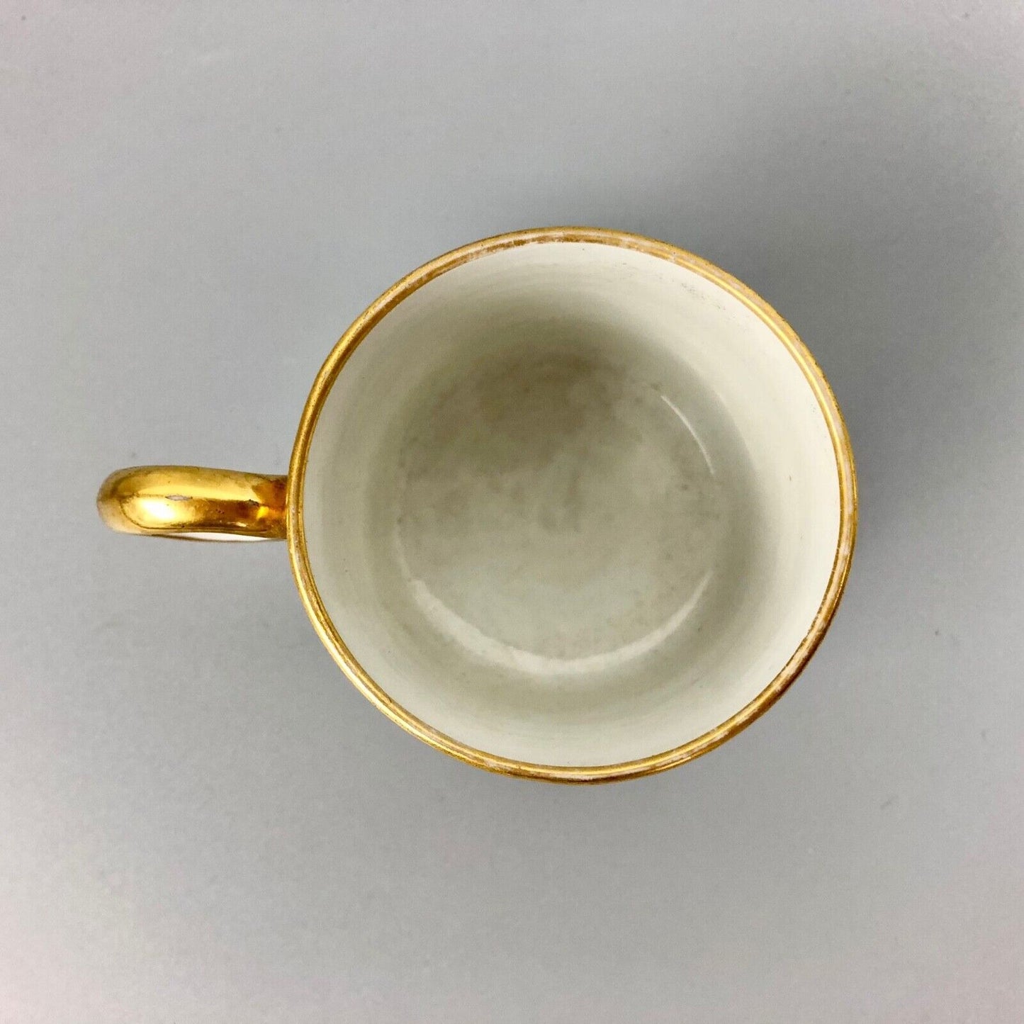 A Barr Worcester coffee can with a floral band on salmon ground c.1795-1805
