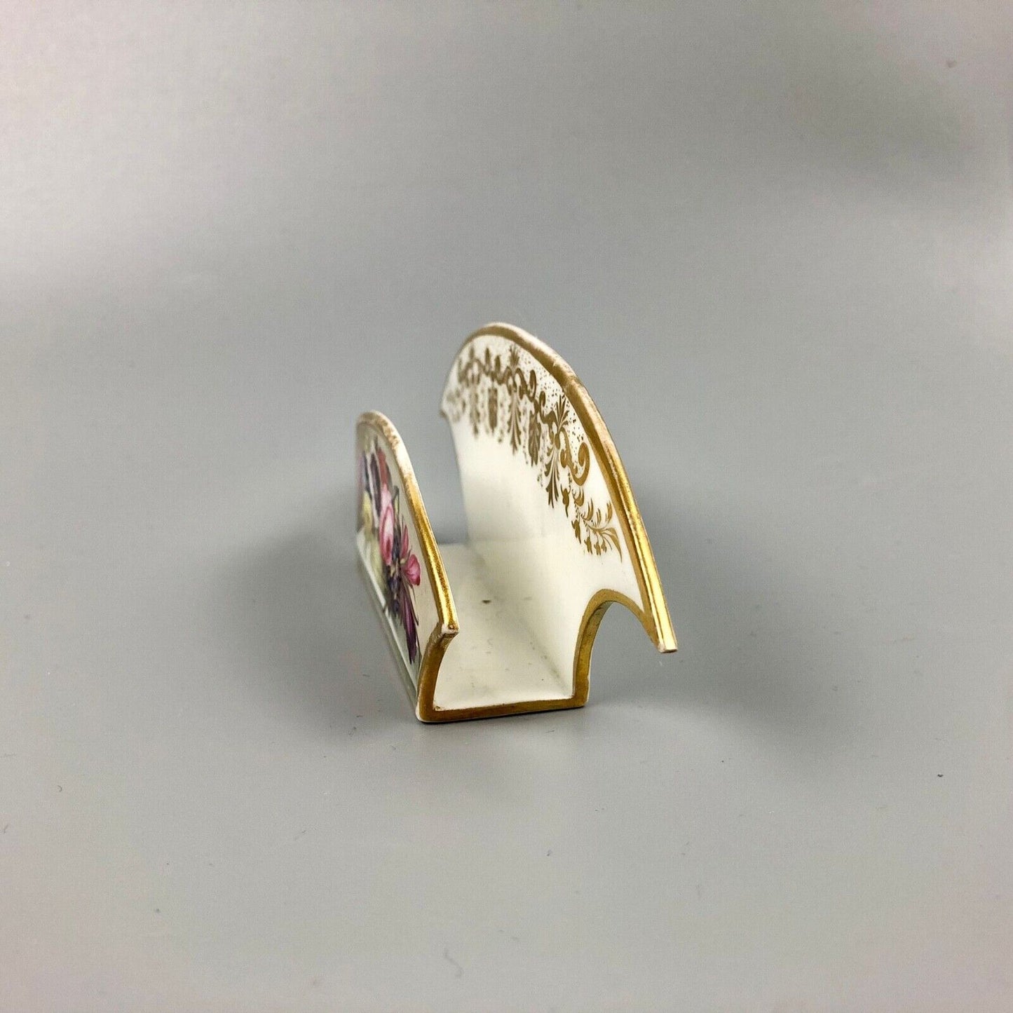 An uncommon Derby letter rack painted with flowers by Leonard Lead c.1820