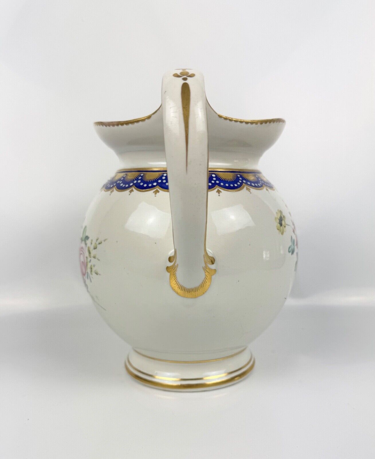 A rare Derby ewer Smith's blue rim and painted with flowers by Withers. c.1780