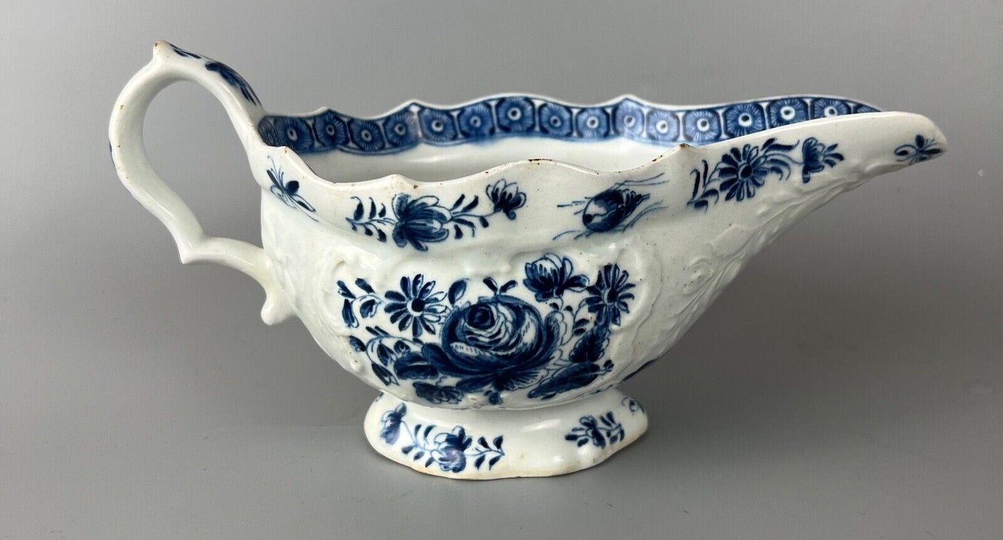A mid 18thc Bow moulded sauceboat painted in underglaze blue c1765-70