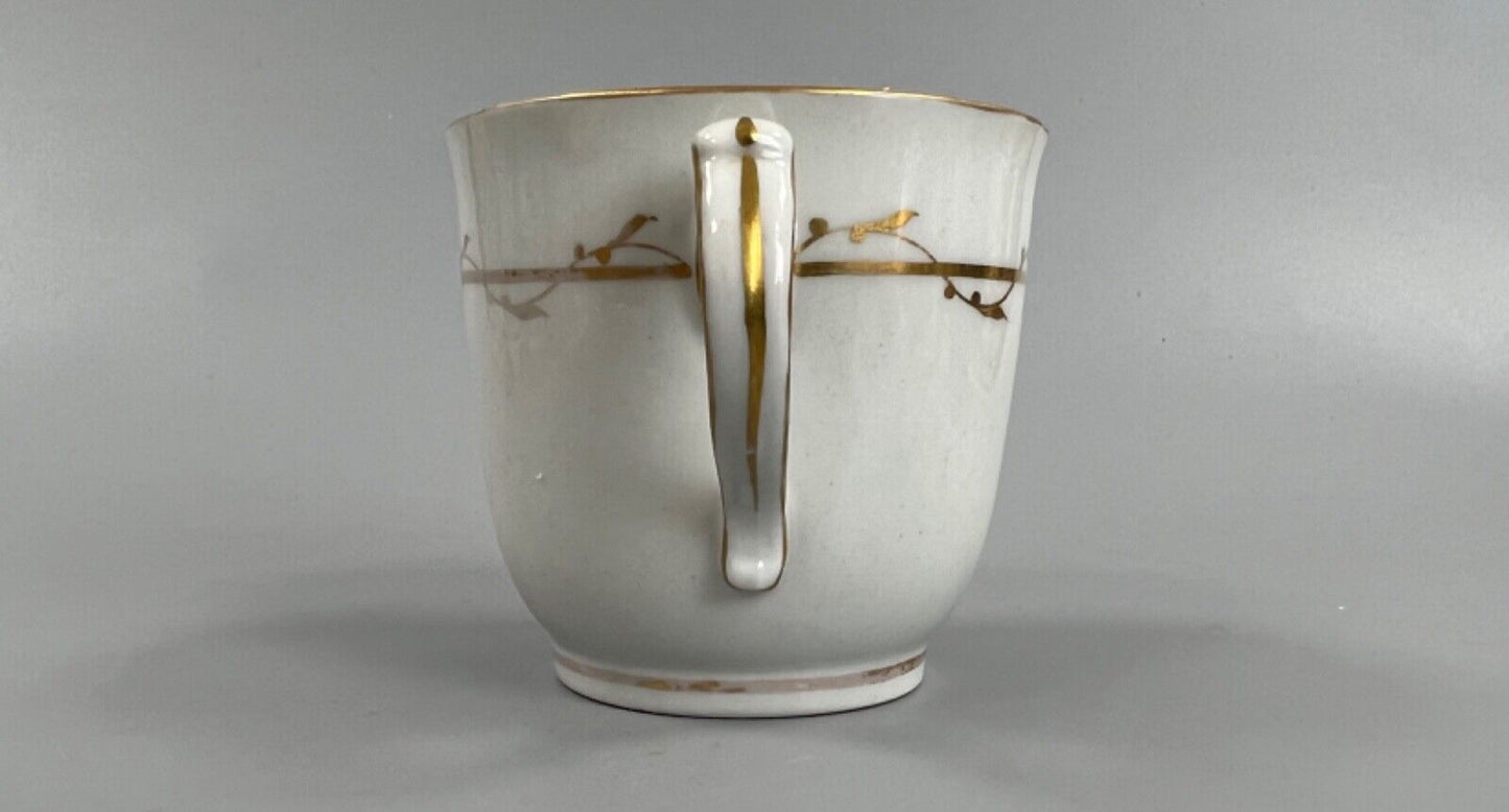 A c.1787-95 New Hall clip handle cup and saucer in pattern number 170