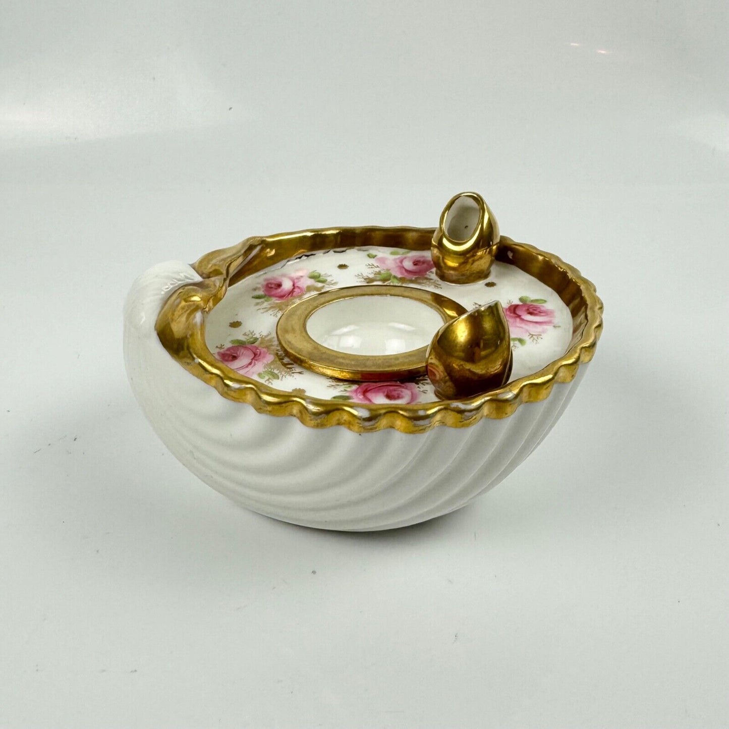 A fine shell-shaped Swansea inkwell and liner painted with roses c1814-26